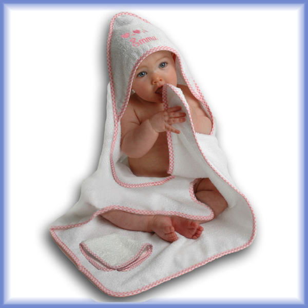 Baby wearing pink hooded towl